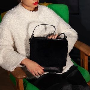 Lotuff Leather Shearling Mini Bucket Bag in Black